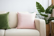 © Photoland - Square canvas pillow mockup on beige sofa, small cotton cushion mockup in living room interior