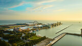 Fototapeta  - Navy Pier on Lake Michigan at sunrise with aerial of Ferris Wheel at dawn, Chicago, IL
