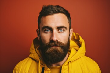 Poster - A man with a beard wearing a yellow jacket. Suitable for various uses