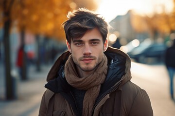 Poster - A man wearing a brown jacket and a scarf. Suitable for fashion, winter, and outdoor-themed projects