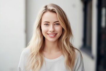 Wall Mural - pretty smiling joyfully female with blond hair, dressed casually, looking to camera