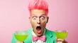 Photo of shocked terrified pink haired man applies green beauty patches under eyes to reduce puffiness holds glass of cocktail stares with omg expression at camera isolated over white