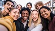 © Malynka - Multicultural happy friends having fun taking group selfie portrait on city street , Multiracial young people celebrating laughing together outdoors , Happy lifestyle concept.