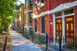 Red brick house, apartment building along inner city neighborhood, mortgage, refinance, rent