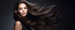 Young stunning woman with healthy long brunette hair. Glossy wavy beautiful hair. Hair salon banner