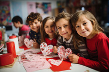 School Kids Happy Making DIY Valentine's Cards In Classroom Look At Camera