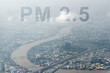High angle view of smog city from PM 2.5 dust. Cityscape of buildings and river with bad weather, smoke and cloud. PM 2.5 and air pollution concept for background or copy space.
