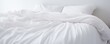 Capture the essence of purity and comfort as a white folded duvet graces the backdrop of a pristine white bed.




