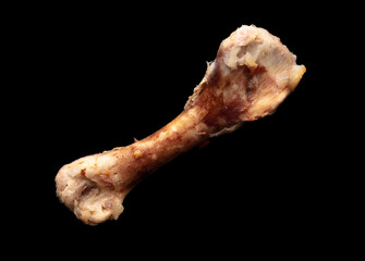 Poster - Chicken bone isolated on black background. Close-up