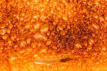 Poster - Bread fried in a toaster as an abstract background. Macro