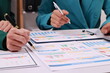 © ผดุงศักดิ์ กิจมานะทร - Business Woman accounting discussing financial with calculator and business chart and graph
