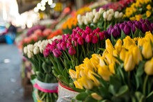 Colorful Bouquets Of Tulips On The Stand In The Flower Shop. Showcase. Floral Shop And Delivery Concept. Flowers Market On The Street. Many Tulips Flowers Growing In Pots For Sale In Florist's Shop.