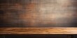 © Fotograf - A simple wooden table placed against a dark background. Suitable for various uses