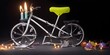 Bike design Birthday cake with candles on it, celebration decorative lights, with copy space, attractive blurred black background