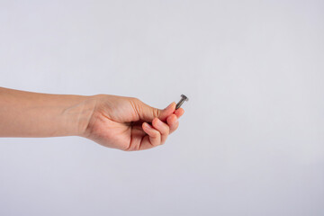 Metal bolt in hand isolated on white background