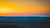 Fototapeta Dmuchawce - minimalistic sunset landscape orange sky and blue ground