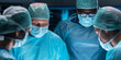 © Acronym - Team of medical doctors performs surgical operation in modern operating room using high-tech technology. Surgeons are working to save the patient in the hospital. Medicine, health and science.