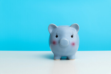 Wall Mural - Piggy bank on the table