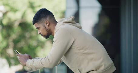 man, phone and typing outdoor on balcony for communication, text message or mobile chat with technol