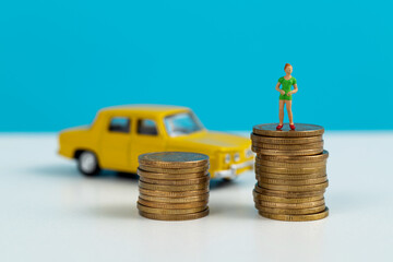 Wall Mural - Miniature woman with coins and car model