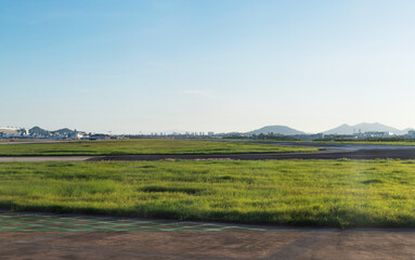 Canvas Print - Empty airport runway under blue sky