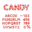 Candy alphabet and numbers with red and white stripes, isolated on white.