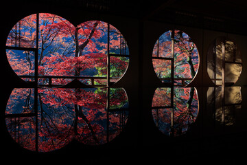 Wall Mural - Japanese autumn scenery in round windows with reflection