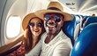 © Malynka - Happy tourist taking selfie inside airplane , Cheerful couple on summer vacation , Passengers boarding on plane , Holidays and transportation