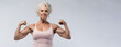 © OleksandrZastrozhnov - Athletic muscular elderly woman showing biceps muscles on white background. Advertising banner layout for a gym or fitness trainer.