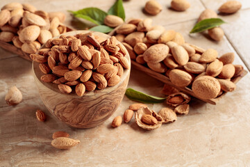 Sticker - Almond nuts in a wooden bowl.