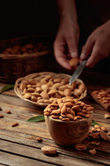 Wall Mural - Almond nuts on a wooden table.