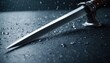  a knife sitting on top of a table next to a knife with a blade sticking out of it's blade, on a wet surface with drops of water.