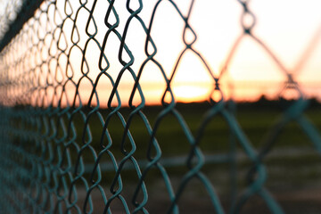Close up of a fence post during sunset