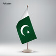 Flag of Pakistan hanging on a flag stand.