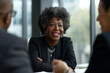 Diverse Corporate Recruitment: Senior African American Woman in a Job Interview with Smiling Managers