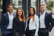 © Surachetsh - professional consultant team showcases unity against the backdrop of corporate buildings, emphasizing their cohesive and collaborative strength. Generative AI.