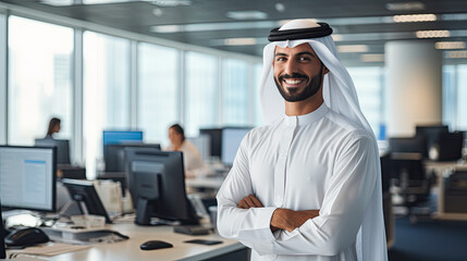 happy emirati arab at office wearing kandura