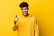 © Uzair - hispanic handsome man laughing, looking happy, positive and surprised, realizing a great idea pointing