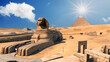Landscape with Egyptian pyramids, Great Sphinx and silhouettes Ancient symbols and landmarks of Egypt for your travel concept to Africa in golden sunlight. The Sphinx in Giza pyramid complex at sunset