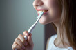 woman brushing teeth, white healthy teeth