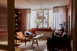 © Maskot - Empty living room with furniture at apartment