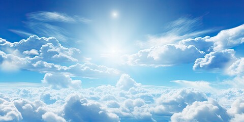 Wall Mural - beauty of summer sky with scattering of fluffy white clouds against backdrop of bright blue. scene e