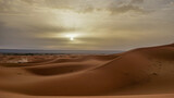 Fototapeta  - 02_Sunrise of the famous and legendary dunes of Erg Chebbi in the Sahara Desert, Morocco.