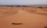 Fototapeta  - 03_Sunrise of the famous and legendary dunes of Erg Chebbi in the Sahara Desert, Morocco.