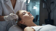 a beautician works with precision to prepare a female client for photo rejuvenation procedures