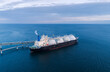 Aerial of Liquified Natural Gas LNG carrier moored to a small gas terminal. Fuel crisis. Sanctions