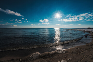 Canvas Print - Winter lake shore in sunset light, dramatic colors