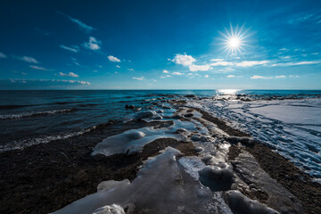 Sticker - Winter lake shore in sunset light, dramatic colors