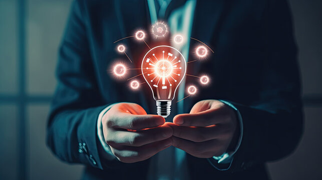A man in a suit holding a light bulb, features a professional man in a suit holding a glowing light bulb. Suitable for business, innovation, creativity, and leadership concepts.