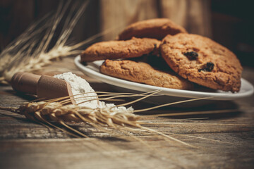 Round cookies with chocolate for the holiday, cookies on a wooden table